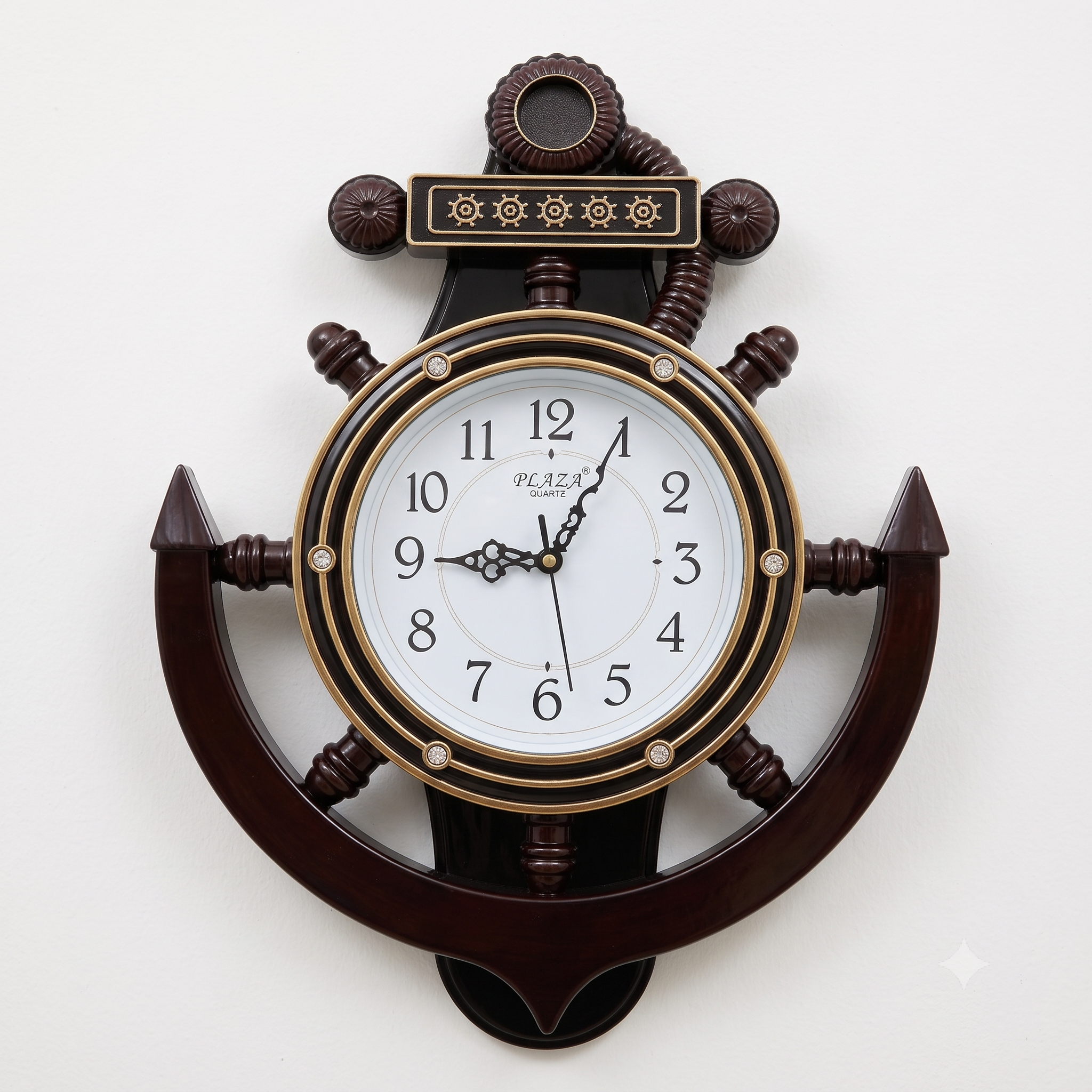 A decorative nautical wall clock shaped like an anchor, featuring a dark brown wood finish, gold-toned accents, and a white clock face with black numerals.