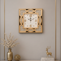 Decorative wall clock on a gray wall with a console table and decorative items.